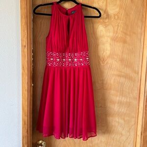 Red dress with embellishments. Size 4